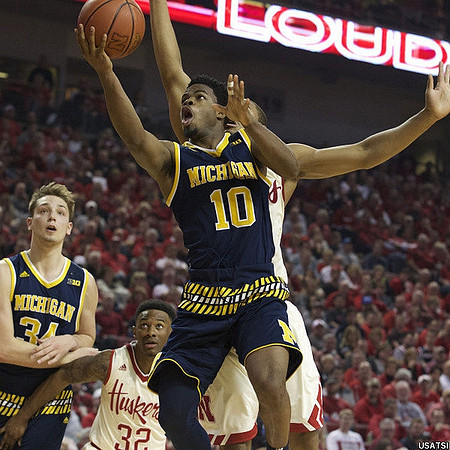 Mark Donnal (34) and Derrick Walton Jr. (10)