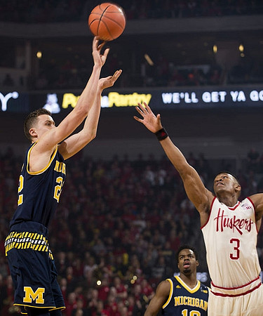 Duncan Robinson (22) and Derrick Walton Jr. (10)