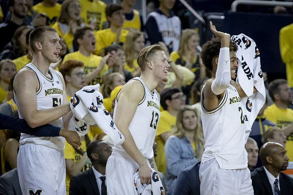 Austin Davis (51), Ignas Brazdeikis (13), and Jordan Poole (2)