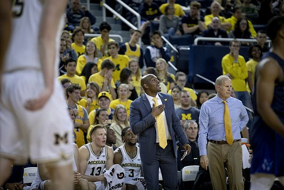 Ignas Brazdeikis (13), Zavier Simpson (3), Deandre Haynes, and John Beilein