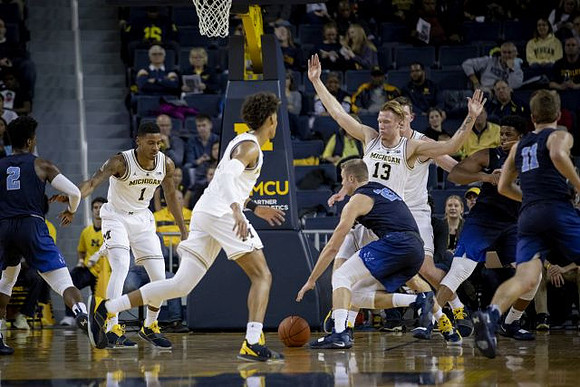 Charles Matthews (1), Jordan Poole (2), Ignas Brazdeikis (13), and Jon Teske (15)
