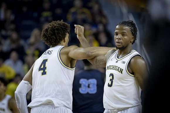 Isaiah Livers (4) and Zavier Simpson (3)