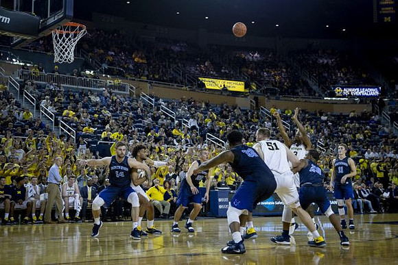 Isaiah Livers (4), Austin Davis (51), and Zavier Simpson (3)