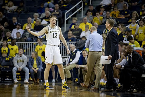 Ignas Brazdeikis (13), John Beilein, Luke Yaklich, and Deandre Haynes