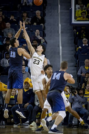 Brandon Johns Jr. (23) and Eli Brooks (55)