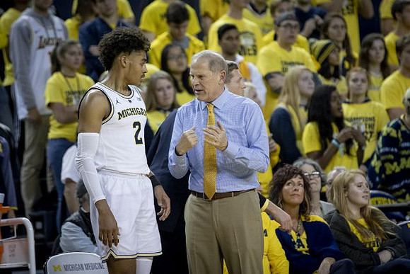 Jordan Poole (2) and John Beilein