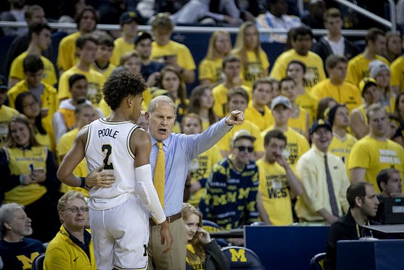 Jordan Poole (2) and John Beilein