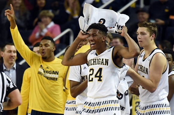 Zak Irvin (21), Aubrey Dawkins (24), and Mark Donnal (34)