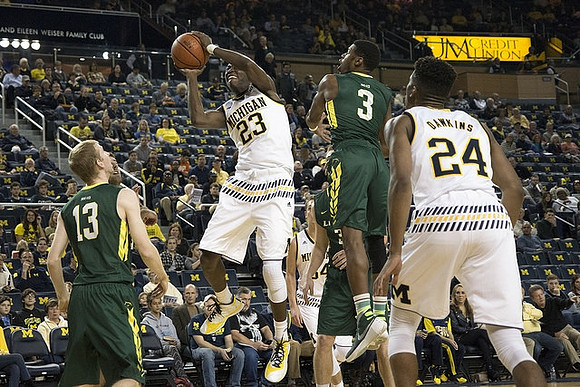Caris LeVert (23) and Aubrey Dawkins (24)
