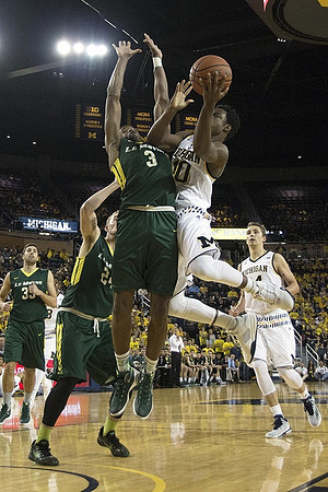 Derrick Walton Jr. (10) and Mark Donnal (34)