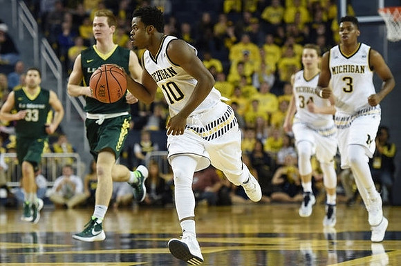 Derrick Walton Jr. (10), Mark Donnal (34), and Kameron Chatman (3)