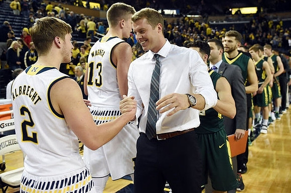Spike Albrecht (2), Moritz Wagner (13), and Le Moyne Head Coach Patrick Beilein