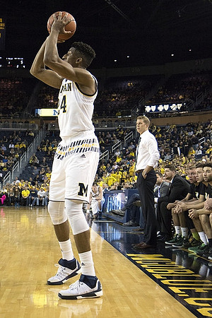 Aubrey Dawkins (24) and Le Moyne Head Coach Patrick Beilein