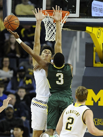 D.J. Wilson (5) and Spike Albrecht (2)