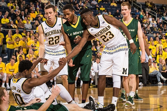 Derrick Walton Jr. (10), Duncan Robinson (22), and Caris LeVert (23)
