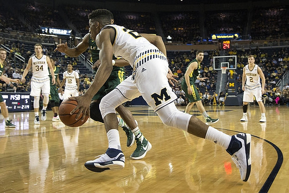 Mark Donnal (34), Muhammad-Ali Abdur-Rahkman (12), Aubrey Dawkins (24), and Spike Albrecht (2)