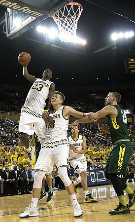 Caris LeVert (23), Moritz Wagner (13), and D.J. Wilson (5)