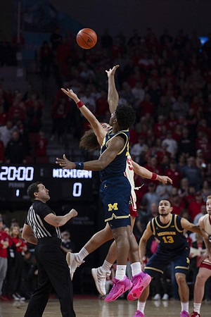 Tarris Reed Jr. (32) and Olivier Nkamhoua (13)