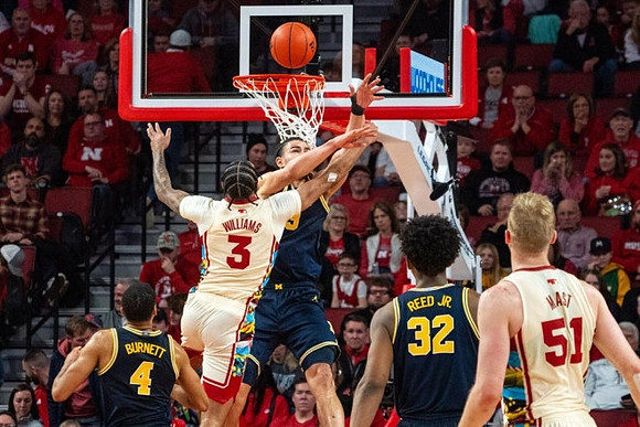 Nimari Burnett (4), Olivier Nkamhoua (13), and Tarris Reed Jr. (32)