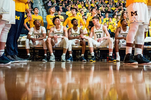 Muhammad-Ali Abdur-Rahkman (12), D.J. Wilson (5), Derrick Walton Jr. (10), Moritz Wagner (13), and Zak Irvin (21)