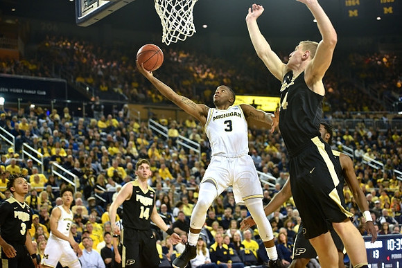 D.J. Wilson (5) and Xavier Simpson (3)