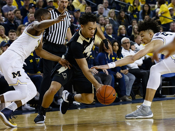 Xavier Simpson (3) and D.J. Wilson (5)
