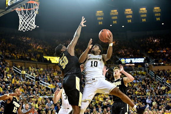 Derrick Walton Jr. (10) and Mark Donnal (34)