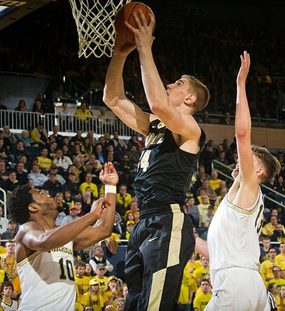 Derrick Walton Jr. (10) and Moritz Wagner (13)
