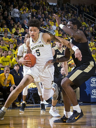 Muhammad-Ali Abdur-Rahkman (12) and D.J. Wilson (5)
