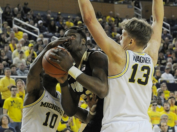 Derrick Walton Jr. (10) and Moritz Wagner (13)