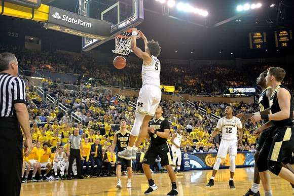 D.J. Wilson (5), Xavier Simpson (3), and Muhammad-Ali Abdur-Rahkman (12)