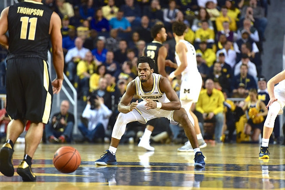 Derrick Walton Jr. (10) and D.J. Wilson (5)