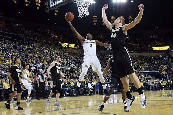 D.J. Wilson (5) and Xavier Simpson (3)