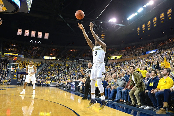 Zak Irvin (21) and Xavier Simpson (3)