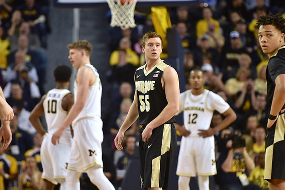 Derrick Walton Jr. (10), Moritz Wagner (13), and Muhammad-Ali Abdur-Rahkman (12)