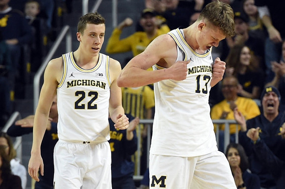 Duncan Robinson (22) and Moritz Wagner (13)