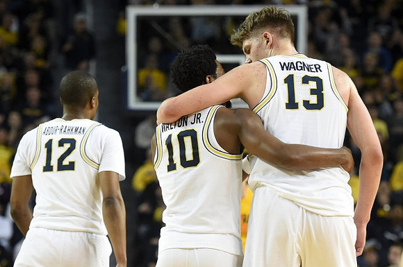 Muhammad-Ali Abdur-Rahkman (12), Derrick Walton Jr. (10), and Moritz Wagner (13)