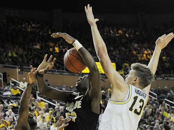 Derrick Walton Jr. (10) and Moritz Wagner (13)