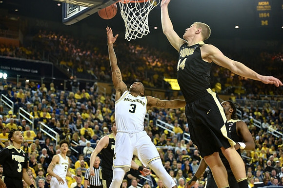 D.J. Wilson (5) and Xavier Simpson (3)