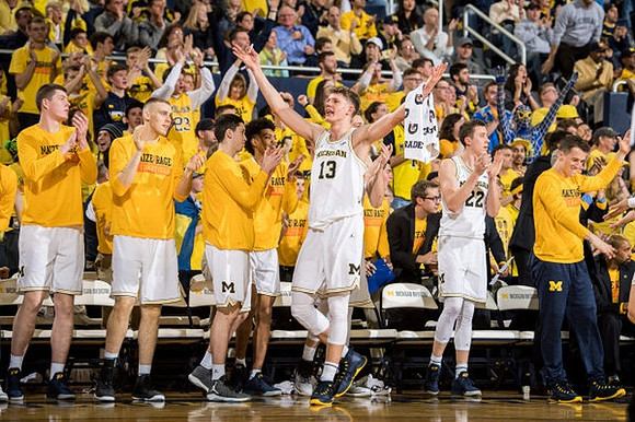 Moritz Wagner (13) and Michigan Team