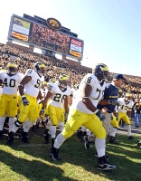 Obi Oluigbo, Rondell Biggs, Alijah Bradley, Gabe Watson, Head Coach Lloyd Carr, David Harris, and Carl Tabb