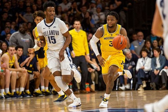 Jordan Poole (2) and Zavier Simpson (3)