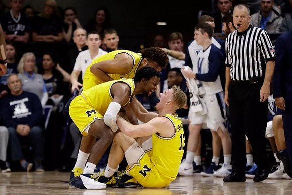 Isaiah Livers (4), Zavier Simpson (3), and Ignas Brazdeikis (13)