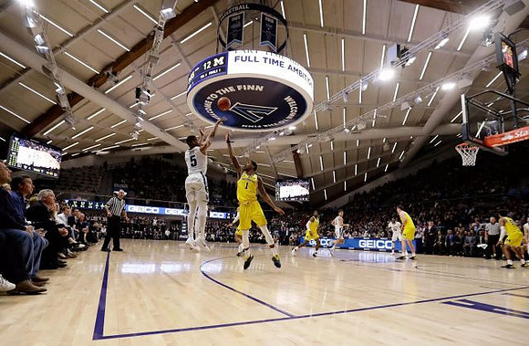 Charles Matthews (1), Zavier Simpson (3), Jon Teske (15), and Eli Brooks (55)
