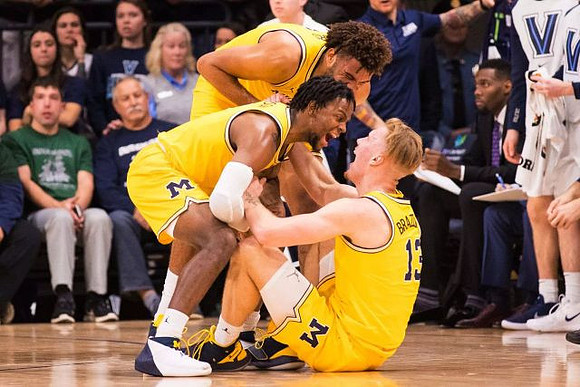 Isaiah Livers (4), Zavier Simpson (3), and Ignas Brazdeikis (13)