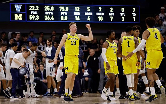 Ignas Brazdeikis (13), Zavier Simpson (3), Charles Matthews (1), Jordan Poole (2), and Isaiah Livers (4)