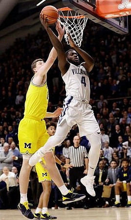 Jon Teske (15) and Jordan Poole (2)