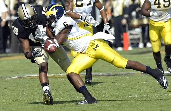 Donovan Warren (6), Brandon Harrison (27), and John Thompson (49)