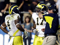Brandon Minor (4), Toney Clemons (17), and Rich Rodriguez