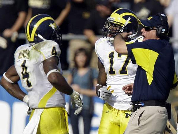Brandon Minor (4), Toney Clemons (17), and Rich Rodriguez